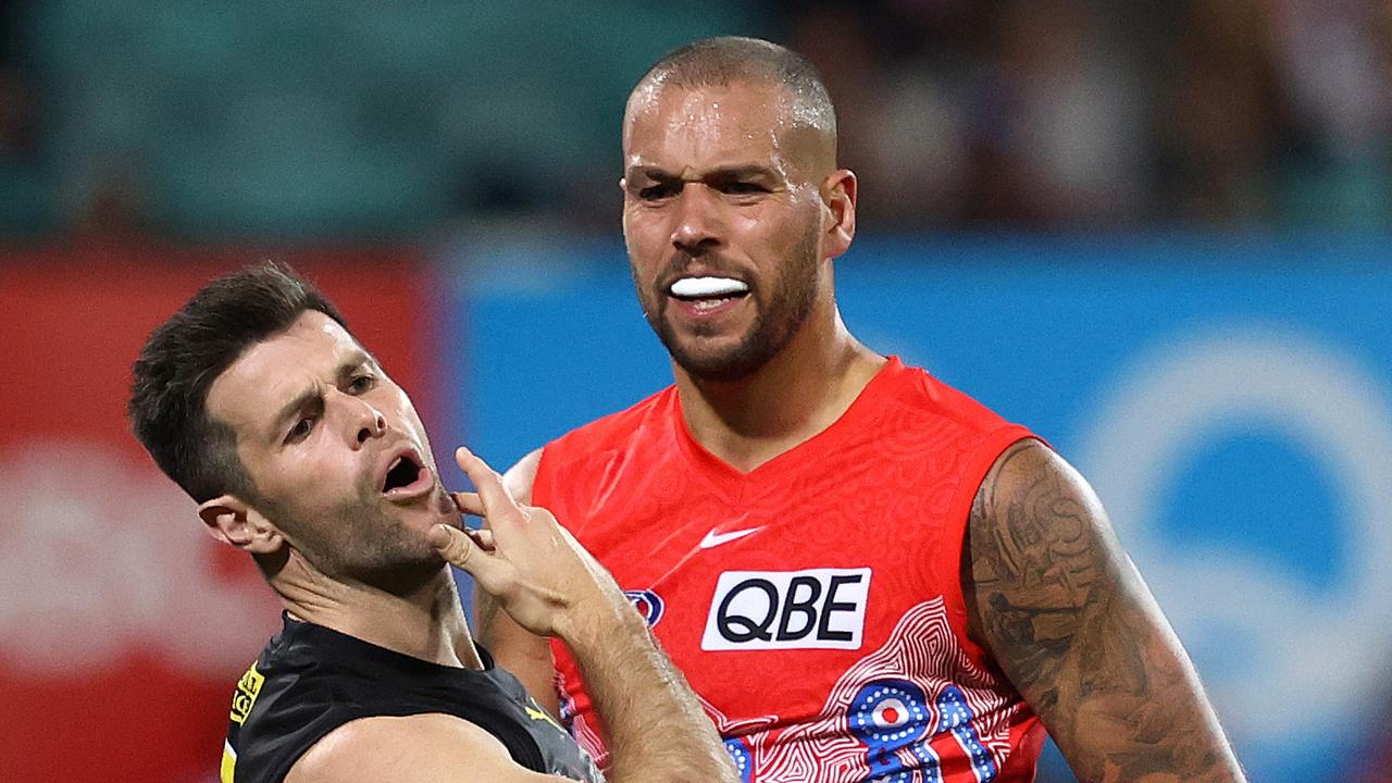 Trent Cotchin clashes with Lance Franklin.