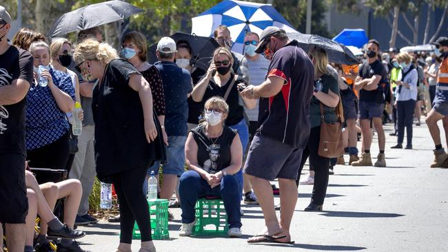 People queue at the Shepparton Showgrounds for testing on Wednesday after a new COVID-19 cluster emerged. Picture: David Geraghty