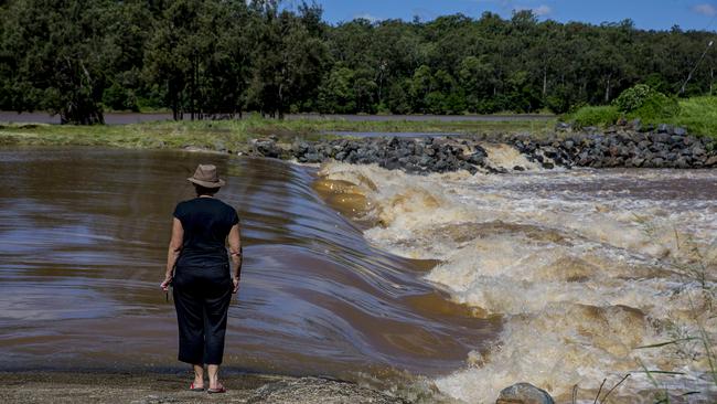 Water flowing over the Oxenford weir after the recent heavy rainfall. Picture: Jerad Williams