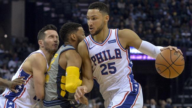 Ben Simmons drives into Memphis Grizzlies guard Garrett Temple.