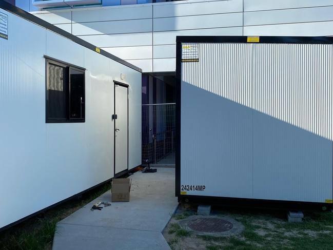 When it’s time to go to the ward, staff change into scrubs inside a demountable building. Picture: Contributed