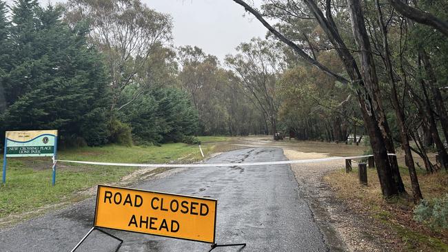 A closed road in Seymour as rain pelts the area.