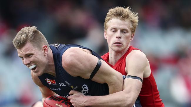 Tom Fields under pressure from Maris Olekalns in the elimination final between South Adelaide and North Adelaide at Adelaide Oval. Picture Sarah Reed