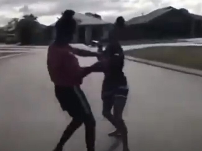 A screenshot of a YouTube video showing two women fighting in Townsville.