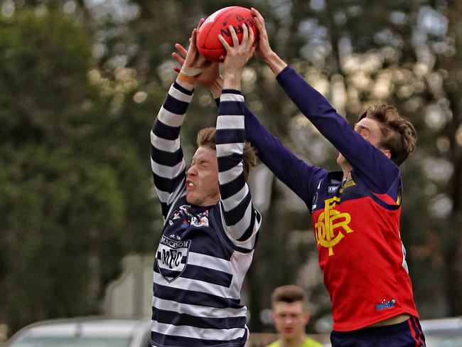 RDFL Diggers Rest v Macedon. Tom Hildebrand Macedon marks in front of Deven Costigan Diggers Rest. Picture: Aaron Cook