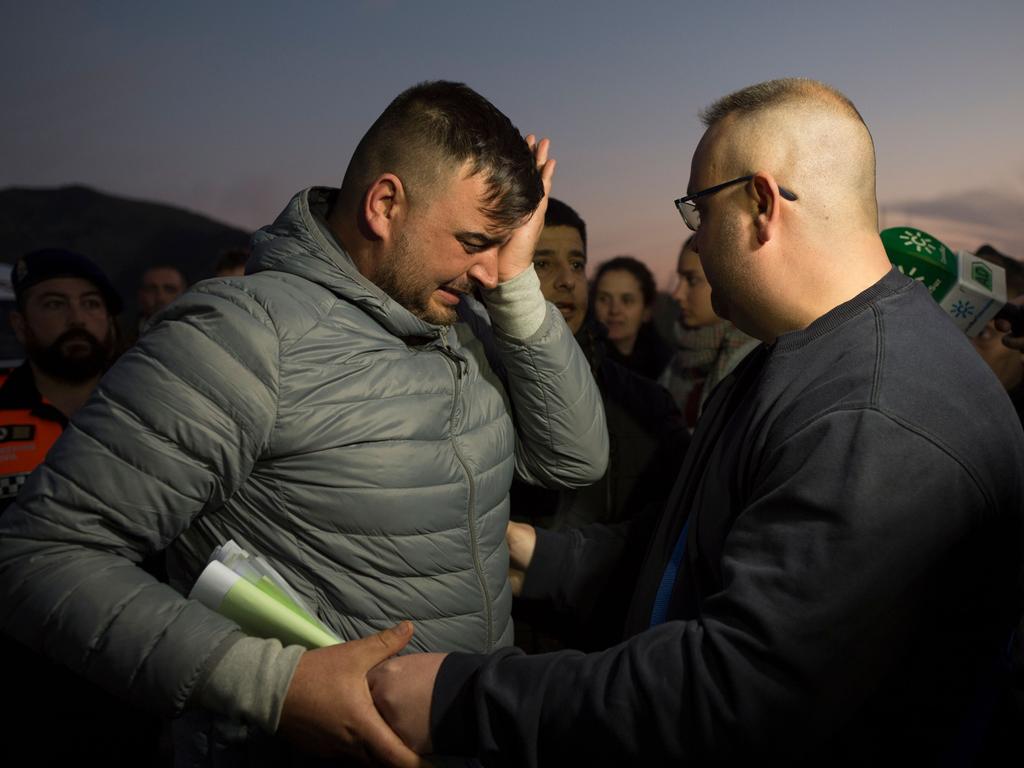 Jose Rosello (left), father of Julen who fell down a well, cries as rescue efforts continue to find the boy in Totalan in southern Spain. Picture: AFP