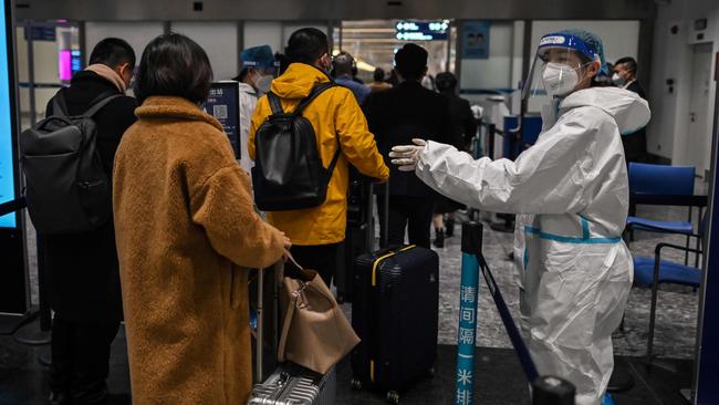 Passengers are checked at the Tianhe International Airport in Wuhan, in China. Picture: AFP