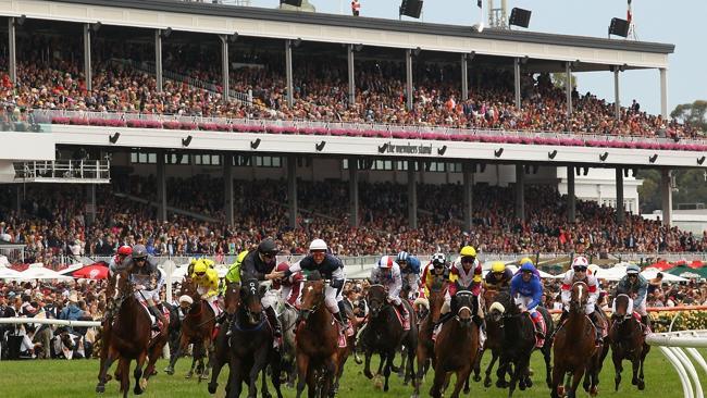 Brett Prebble riding Green Moon (white cap) is congratulated by James McDonald aboard Fiorente as he wins the 2012 Melbourne Cup. Picture: Getty Images