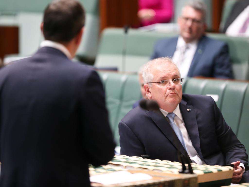 Prime Minister Scott Morrison listening as Shadow Treasurer Jim Chalmers asks a question during Question Time at Parliament House in Canberra. Picture: Alex Ellinghausen