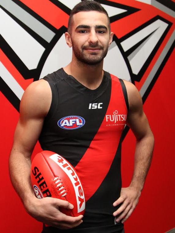 Adam Saad tries on an Essendon jumper. Picture: SUPPLIED