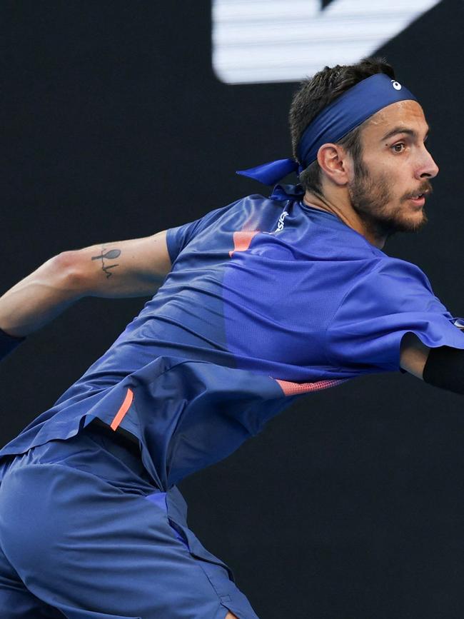 Lorenzo Musetti’s tennis racquet tattoo on his left arm. Picture: Adrian Dennis / AFP