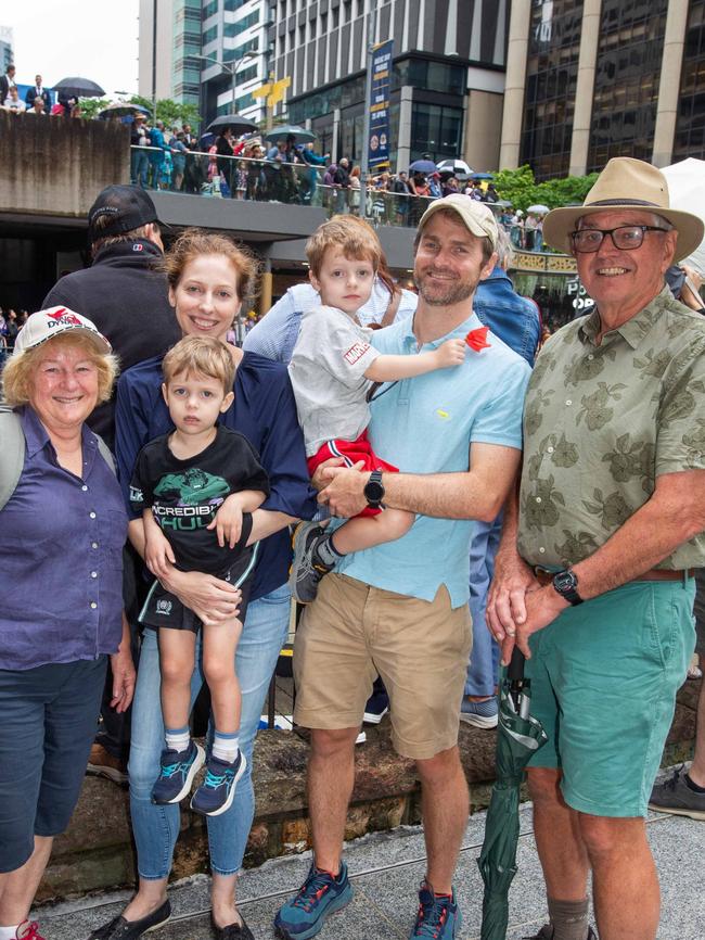 Thousands of people have braved the rain to gather in Brisbane for Anzac Day services. Picture: Grace Kessels