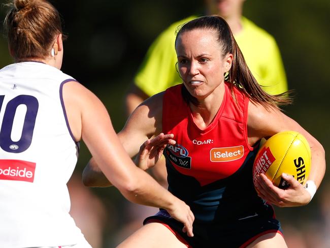 MELBOURNE, AUSTRALIA - MARCH 18: Daisy Pearce of the Demons is tackled by Stacey Barr of the Dockers during the 2017 AFLW Round 07 match between the Melbourne Demons and the Fremantle Dockers at Casey Fields on March 18, 2017 in Melbourne, Australia. (Photo by Adam Trafford/AFL Media/Getty Images)