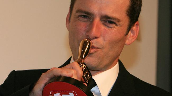 Karl Stefanovic kisses his Gold Logie in 2011.