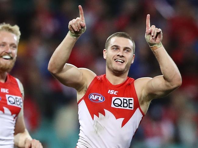 SYDNEY, AUSTRALIA - JUNE 09: Tom Papley of the Swans celebrates with his team mates after kicking a goal during the round 12 AFL match between the Sydney Swans and the West Coast Eagles at Sydney Cricket Ground on June 09, 2019 in Sydney, Australia. (Photo by Mark Kolbe/Getty Images)