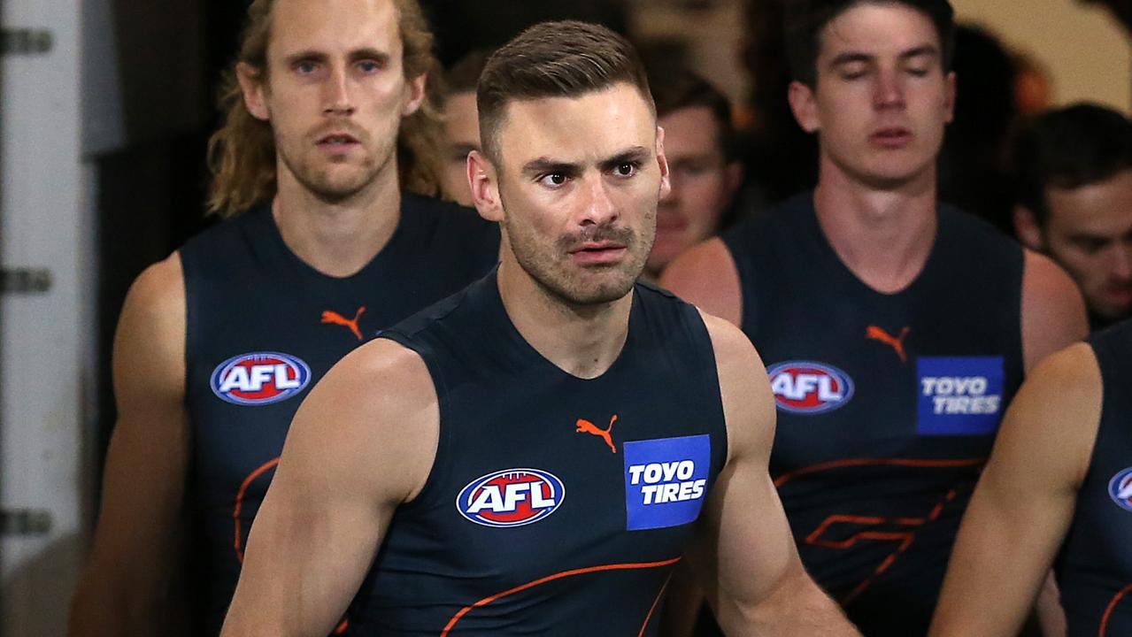 GOLD COAST, AUSTRALIA - JULY 18: Stephen Coniglio of the Giants leads his team out during the round 18 AFL match between Greater Western Sydney Giants and Sydney Swans at Metricon Stadium on July 18, 2021 in Gold Coast, Australia. (Photo by Jono Searle/AFL Photos/via Getty Images)