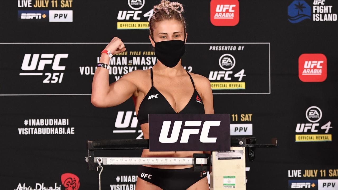 Paige VanZant poses on the scale during the UFC 251 official weigh-ins. Photo by Jeff Bottari/Zuffa LLC via Getty Images.