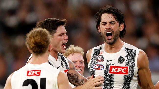 MELBOURNE, AUSTRALIA - APRIL 25: Brodie Grundy of the Magpies celebrates a goal with teammates during the 2022 AFL Round 06 match between the Essendon Bombers and the Collingwood Magpies at the Melbourne Cricket Ground on April 25, 2022 in Melbourne, Australia. (Photo by Dylan Burns/AFL Photos via Getty Images)