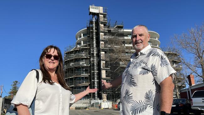 Kathryn and Garry Ebbott say more high rise apartment towers in Frankston like the Horizon going up behind them are critical for the suburb’s survival. Picture: Lucy Callander