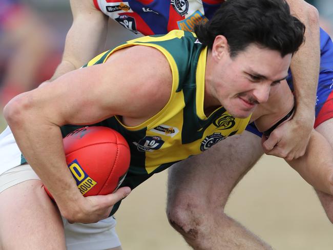 South Barwon's Thomas Burke tackles Leopold's Daniel Pitcher. GFNL football between South Barwon and Leopold at Belmont. Picture: Alan Barber