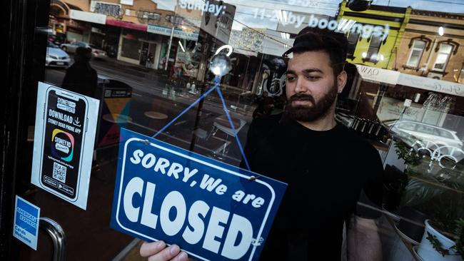 Mas Azemi of Mas Barber Shop closes his Brunswick shop on Wednesday. Picture: Darrian Traynor/Getty Images