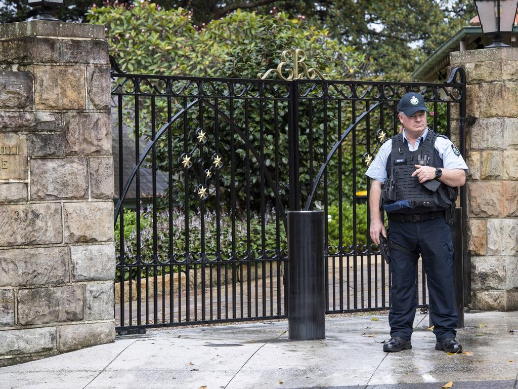 An officer stands outside Kirribilli House on Sydney Harbour. Picture: Monique Harmer