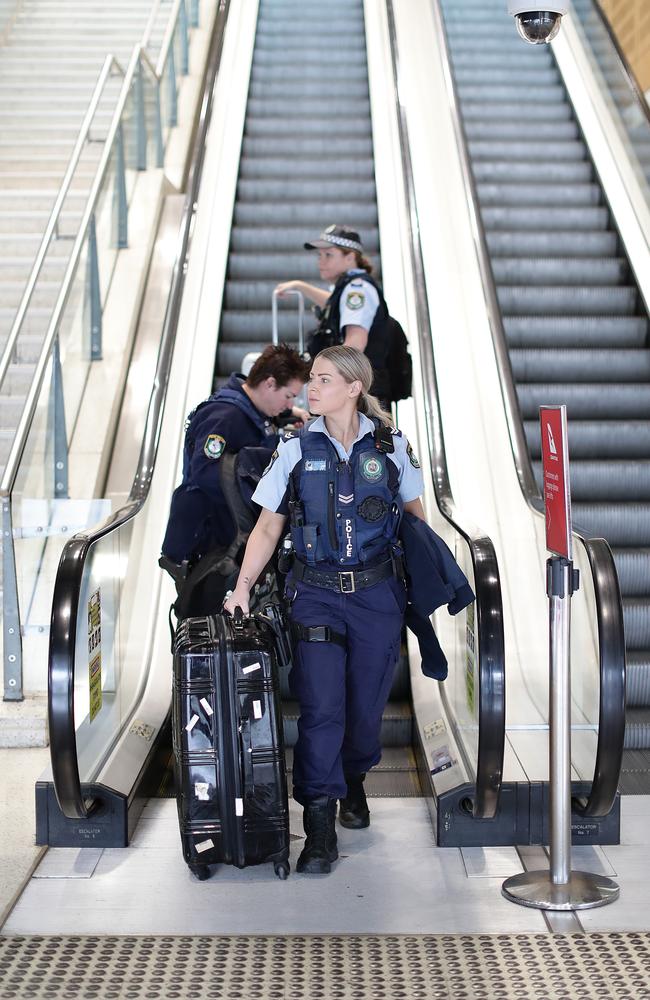 Police arrive at Sydney’s domestic airport on Tuesday ahead of the border lockdown. Picture: Mark Metcalfe/Getty Images