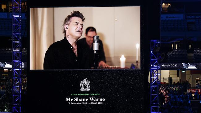 Robbie Williams sings at the Shane Warne Memorial at the MCG. Picture: Ian Currie