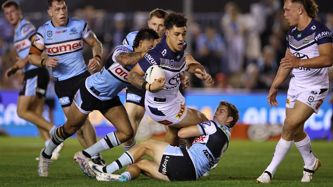 Jamayne Taunoa-Brown of the Cowboys is tackled during the round nine NRL match between Cronulla Sharks and North Queensland Cowboys at PointsBet Stadium on April 27, 2023 in Sydney, Australia. (Photo by Cameron Spencer/Getty Images)