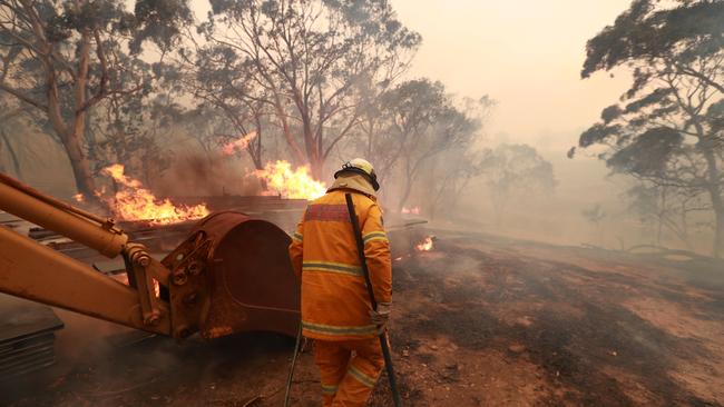 A large fire is burning out of control in the small country area of Bombay, NSW just outside of Braidwood in NSW. RFS volunteers from Carwoola protect property. Picture Gary Ramage