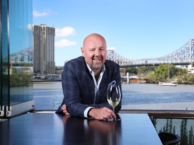 Chris Higgins at his recently purchased Mr &amp; Mrs G Riverbar at Eagle Street Pier. Picture: Tara Croser