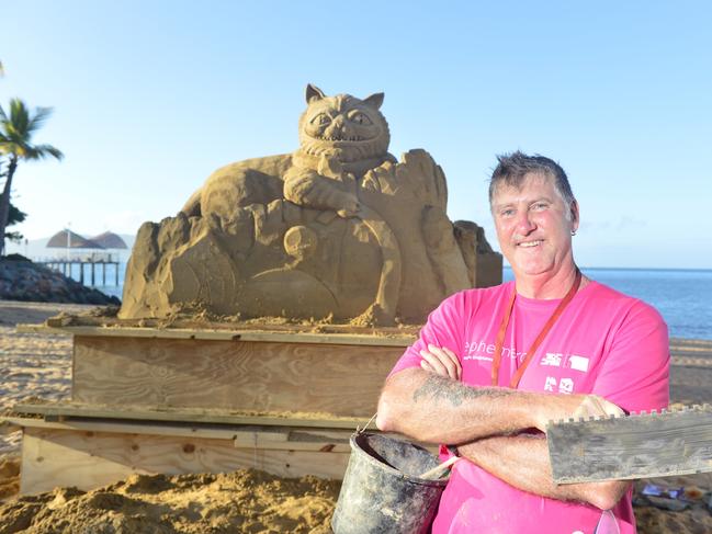 Sand sculptor Peter Redmond from Melbourne with his creation at The Strand