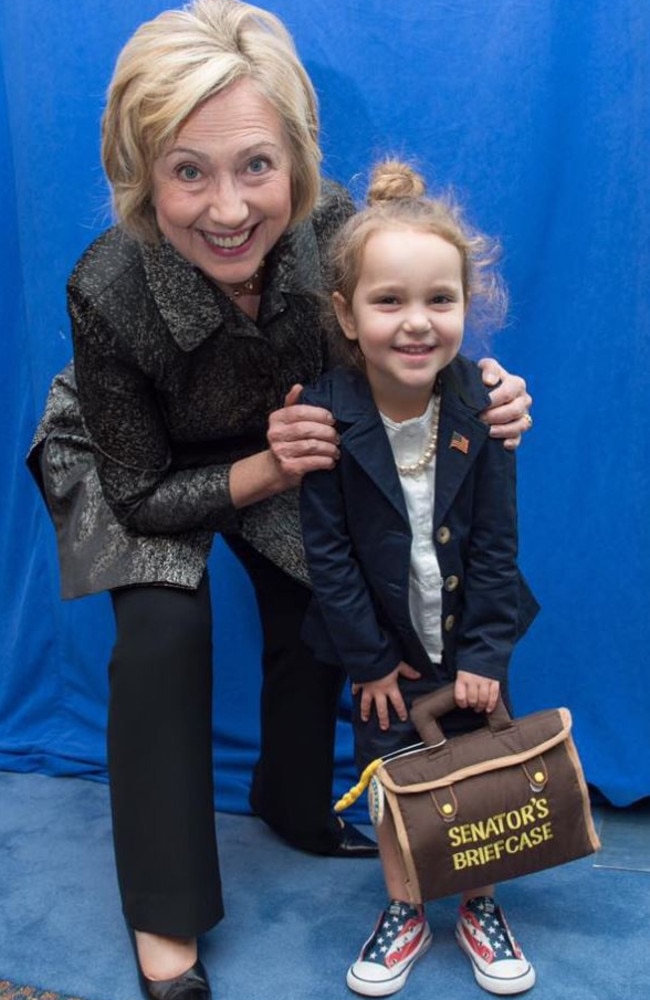Mini-me: Hillary Clinton poses with four-year-old Sullivan, who has dressed up as her idol for Halloween. Picture: Facebook.