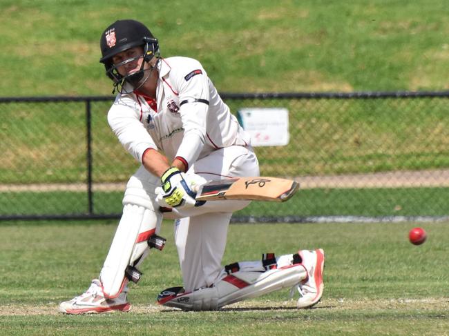 South Caulfield's Lewis Mildenhall sweeps. Picture: Ron Weil