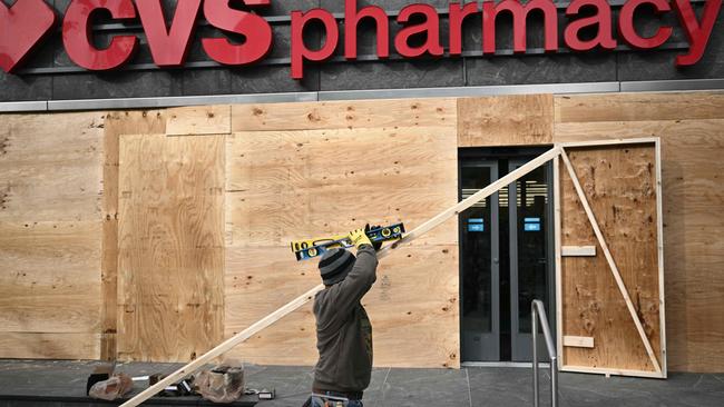 Businesses near the White House set up security measures in Washington, DC, on November 4, 2024, ahead of possible violence on and after the November 5 election. Picture: Brendan SMIALOWSKI / AFP