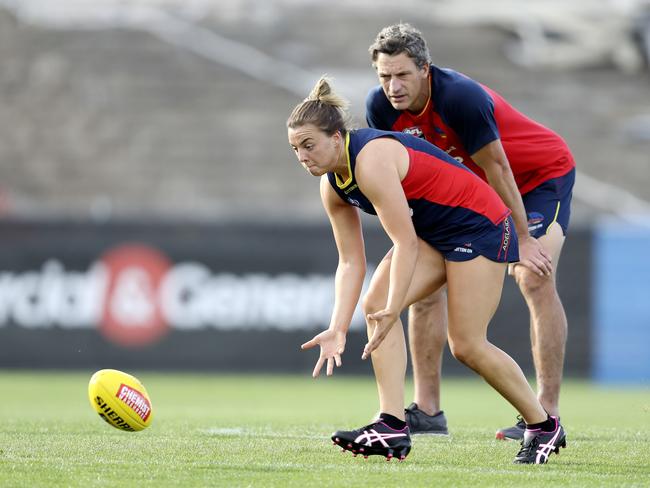 New Crows AFLW head coach Matthew Clarke watches Ebony Marinoff collect the ball off of the ground. Picture SARAH REED