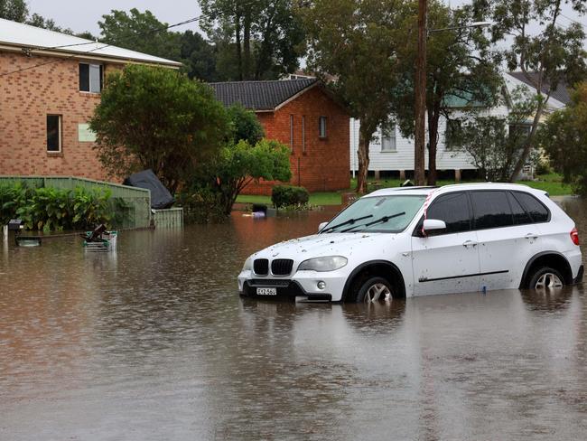 Roads are inundated with water across towns such as Taree. Picture: NewsWire / Scott Calvin