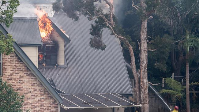 Fire rips through the house yesterday. Picture: James Gourley