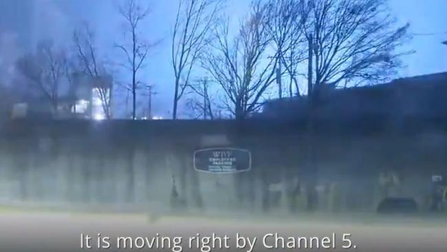 A cameraman continues to film as a tornado bears down on a TV station in Nashville, Tennessee.