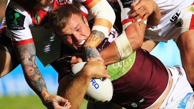 Jake Trbojevic of Manly gets tackled.