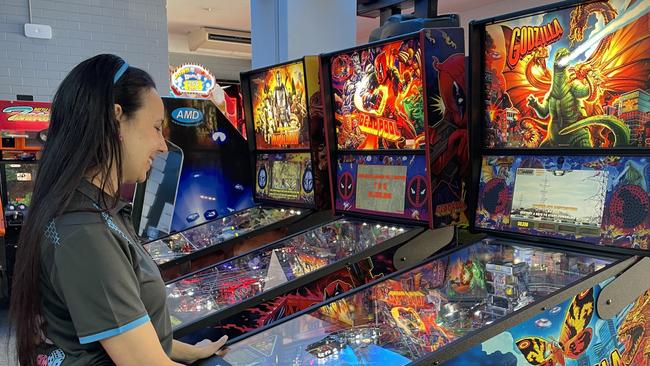 Play Back Gympie owner Aisha Belling plays pinball on the machine that inspired ‘Zoinkilla.’