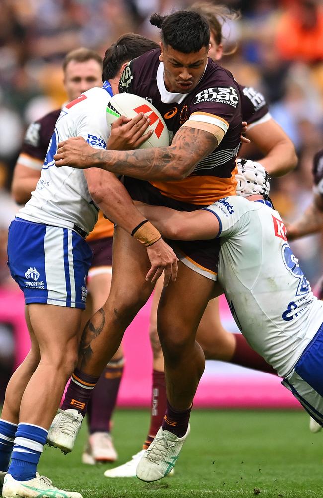 BRISBANE, AUSTRALIA – JULY 27: Xavier Willison of the Broncos is tackled during the round 21 NRL match between Brisbane Broncos and Canterbury Bulldogs at Suncorp Stadium, on July 27, 2024, in Brisbane, Australia. (Photo by Albert Perez/Getty Images)