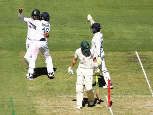 MELBOURNE, AUSTRALIA - DECEMBER 26: Hanuma Vihari of India celebrates taking the wicket of Tim Paine of Australia during day one of the Second Test match between Australia and India at Melbourne Cricket Ground on December 26, 2020 in Melbourne, Australia. (Photo by Robert Cianflone/Getty Images)