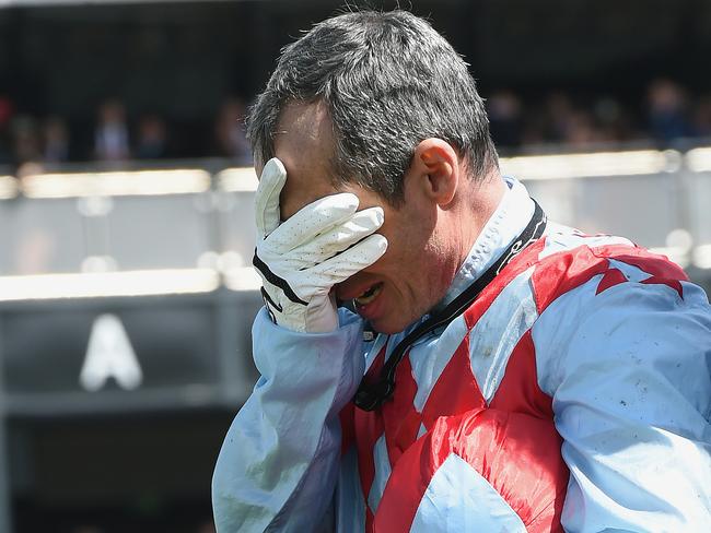 Red Cadeaux jockey Gerald Mosse was devastated post race. Picture: AP Photo/Andy Brownbill