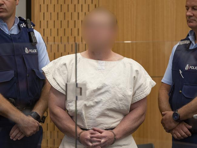 Brenton Tarrant was flanked by guards as he appeared in court yesterday. Picture: New Zealand Herald/Mark Mitchell