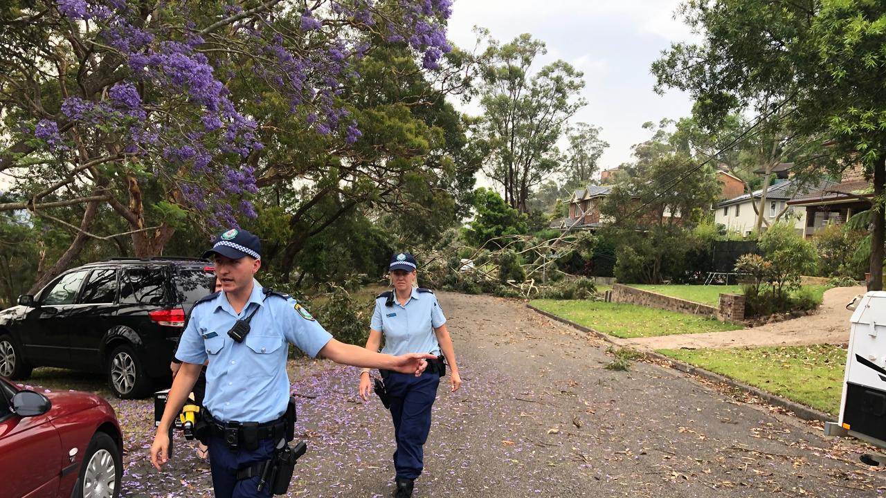 Police warn residents to stay indoors in Andrew St, Davidson, due to fears over stretched powerlines breaking. Picture: Jim O'Rourke.