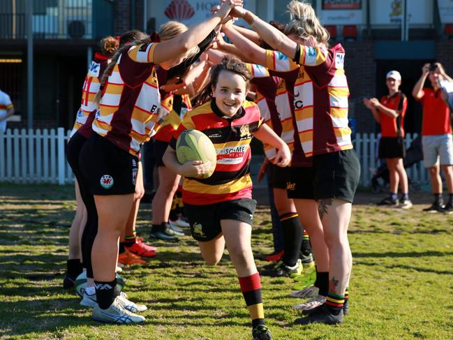 HORNSBY ADVOCATE /AAPHornsby LSS: Nine-year-old Jasmine Truskett leads the Hornsby  first grade rugby team out onto Mark Taylor Oval at WaitaraSaturday 3rd August 2019Nine-year-old Jasmine Truskett is the first girl to play 100 games for Hornsby Junior Rugby Club(AAP IMAGE / MARK SCOTT)