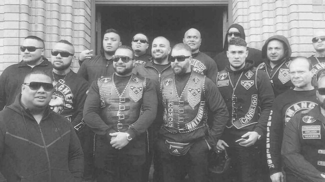 Pitasoni Ulavalu (centre rear) pictured with other senior Australian gang office holders, was stabbed and killed at Kokomo's night club in Canberra.