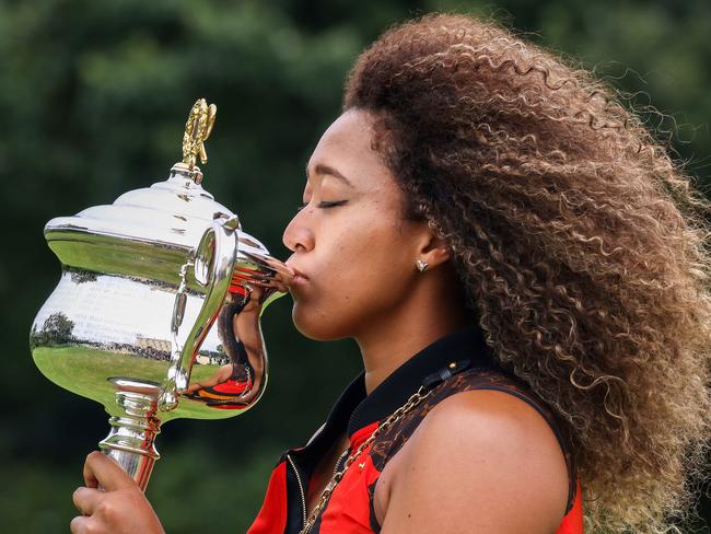 MELBOURNE , AUSTRALIA - NewsWire Photos FEBRUARY 21, 2021 : Australian Open 2021 WomenÃs Champion Naomi Osaka celebrates her win with the trophybeing her fourth Grand Slam title  at Government House, Melbourne. Picture : NCA NewsWire  /  Ian Currie