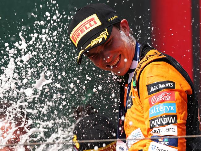 BUDAPEST, HUNGARY - JULY 21: Race winner Oscar Piastri of Australia and McLaren celebrates his maiden race win on the podium during the F1 Grand Prix of Hungary at Hungaroring on July 21, 2024 in Budapest, Hungary. (Photo by Dean Mouhtaropoulos/Getty Images)